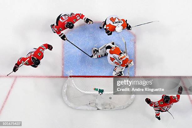 Kris Versteeg, Marian Hossa and Kris Versteeg of the Chicago Blackhawks celebrate after a goal against Michael Leighton and Kimmo Timonen in Game...