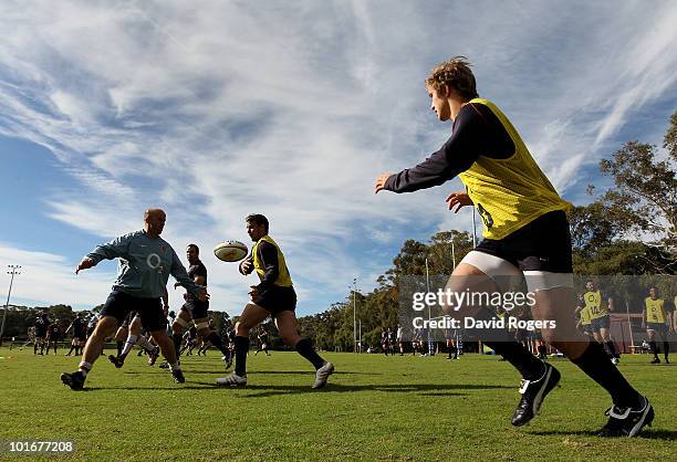 Olly Barkley off loads the ball to team mate Mathew Tait during the England rugby training session held at McGillveray Oval on June 7, 2010 in Perth,...