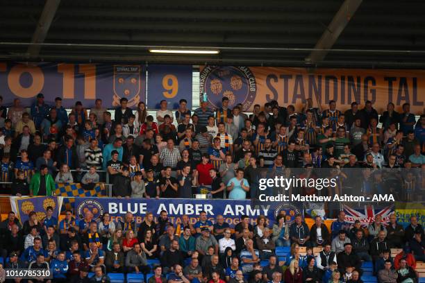 Shrewsbury Town fans in the safe standing area during the Carabao Cup First Round match between Shrewsbury Town and Burton Albion at Montgomery...