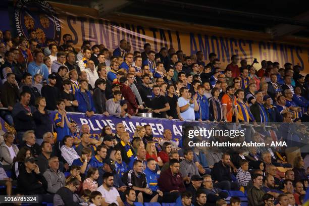 Shrewsbury Town fans in the safe standing area during the Carabao Cup First Round match between Shrewsbury Town and Burton Albion at Montgomery...