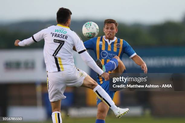 Scott Fraser of Burton Albion and Charlie Colkett of Shrewsbury Town during the Carabao Cup First Round match between Shrewsbury Town and Burton...