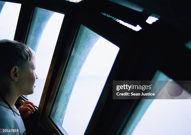 young boy in crown of statue of liberty - insel liberty island stock-fotos und bilder