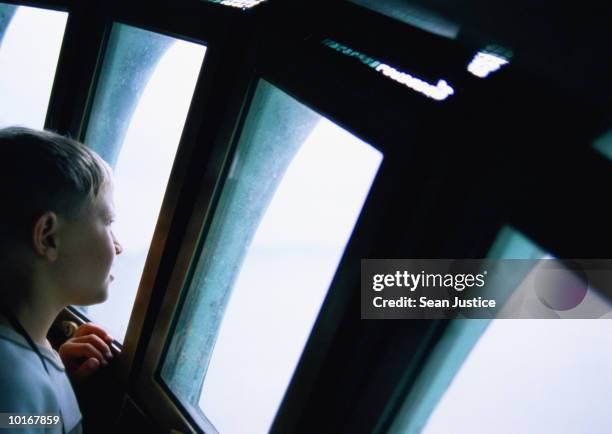 young boy in crown of statue of liberty - liberty island stock pictures, royalty-free photos & images