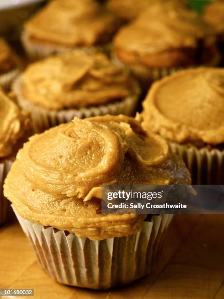 banana cupcakes with peanut butter frosting - cupcake stock pictures, royalty-free photos & images