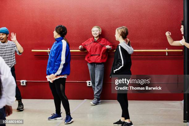 laughing hip hop dance group hanging out during break in practice in dance studio - 12 year old indian girl stock pictures, royalty-free photos & images