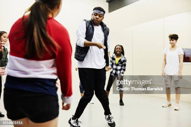 hip hop dance instructor leading class in dance studio - hip hop idols stock pictures, royalty-free photos & images