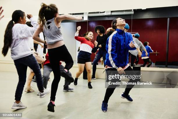 hip hop dance group dancing together in studio during practice - dance studio stock pictures, royalty-free photos & images