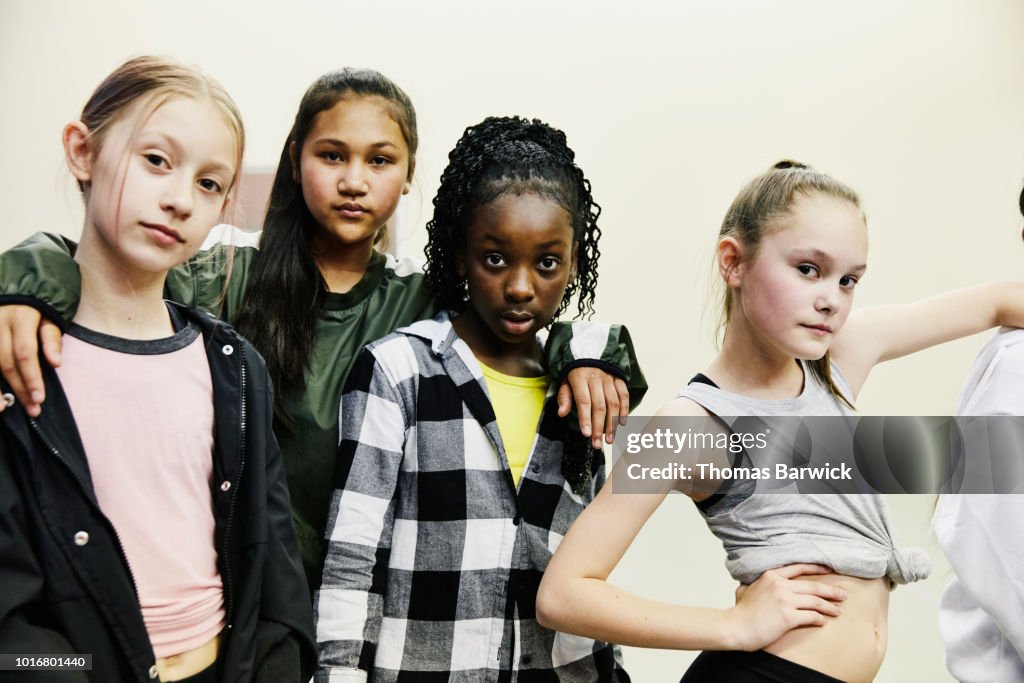 Portrait of girls in hip hop dance group standing in studio after practice