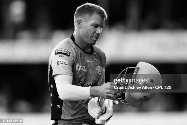 In this handout image provided by CPL T20, David Warner of St Lucia Stars is dismissed during the Hero Caribbean Premier League match between Jamaica...