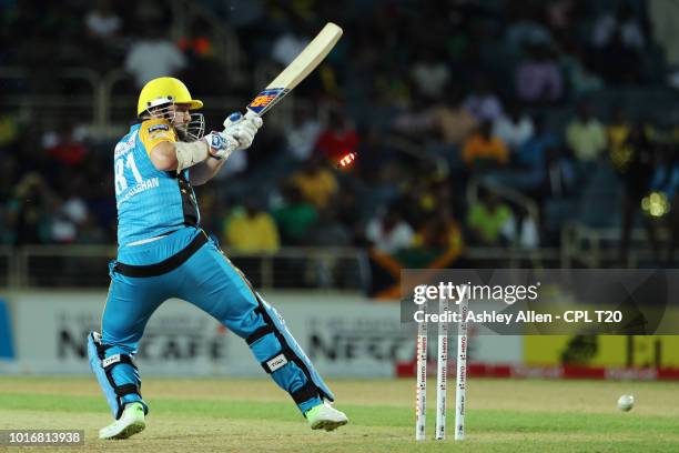 In this handout image provided by CPL T20, Mitchell McClenaghan of St Lucia Stars is bowled by Oshane Thomas during the Hero Caribbean Premier League...