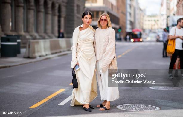 Katarina Petrovic wearing creme white dress and Celine Aagaard wearing white silk dress, knit seen outside Epilogue during Oslo Runway SS19 on August...