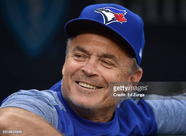 John Gibbons manager of the Toronto Blue Jays looks on from the dugout as he waits for a game to begin agains the Kansas City Royals at Kauffman...