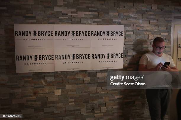 Supporters of Democratic congressional candidate Randy Bryce wait for returns to come in at an election-night rally on August 14, 2018 in Racine,...