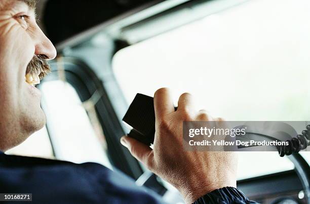 truck driver talking on cb, close-up - walkie talkie stock pictures, royalty-free photos & images
