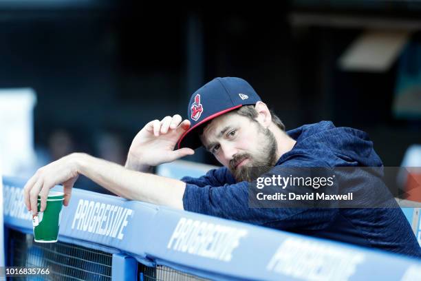 Andrew Miller of the Cleveland Indians looks on from the dugout before the start of the game against the Los Angeles Angels of Anaheim at Progressive...