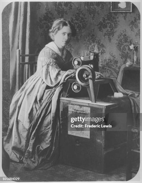 Woman operating a Singer patent sewing machine, USA, circa 1860. The machine sits on a crate labelled 'Singer's patent sewing machine'.