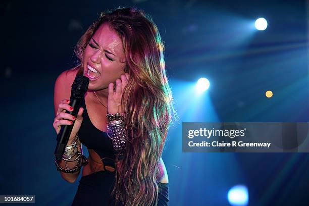 Miley Cyrus performs on stage at G-A-Y at Heaven nightclub on June 5, 2010 in London, England.