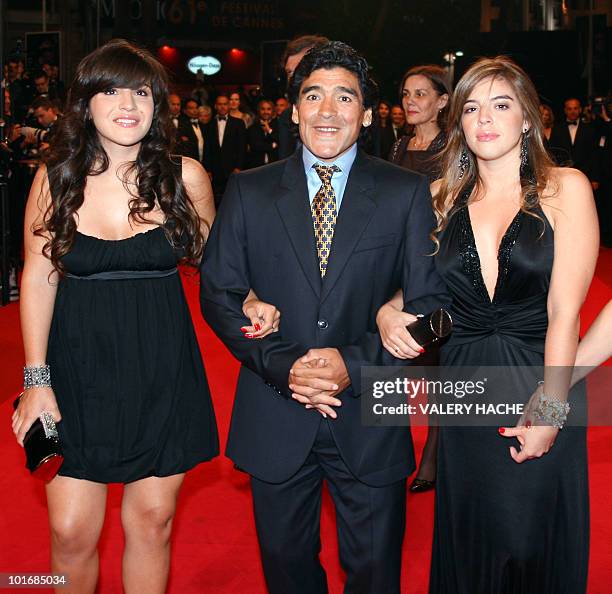 Former Argentinian football player Diego Maradona flanked by his daughters Giannina and Dalma arrives to attend the screening of Serbian director...