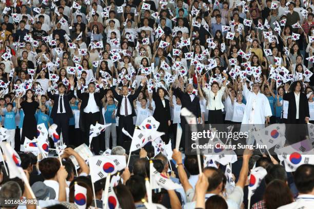 South Koreans wave national flags during the 73rd National Liberation Day ceremony at National Museum on August 15, 2018 in Seoul, South Korea. South...