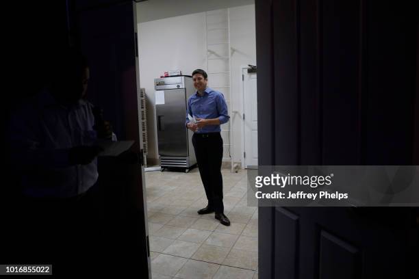 Republican candidate Bryan Steil for U.S. Congress waits in a kitchen area moments before giving a speach to supporters after winning in the Primary...