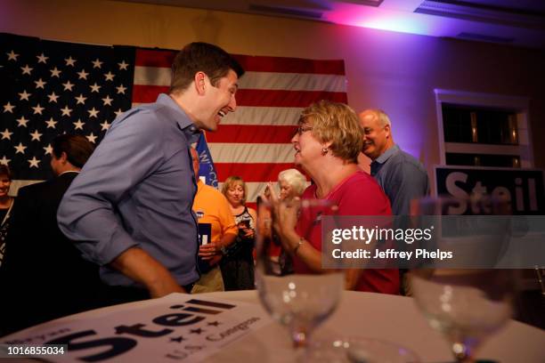 Republican candidate Bryan Steil for U.S. Congress celebrates with supporters after winning in the Primary election on August 14, 2018 in Burlington,...