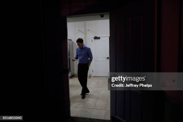 Republican candidate Bryan Steil for U.S. Congress waits in a kitchen area moments before giving a speach to supporters after winning in the Primary...