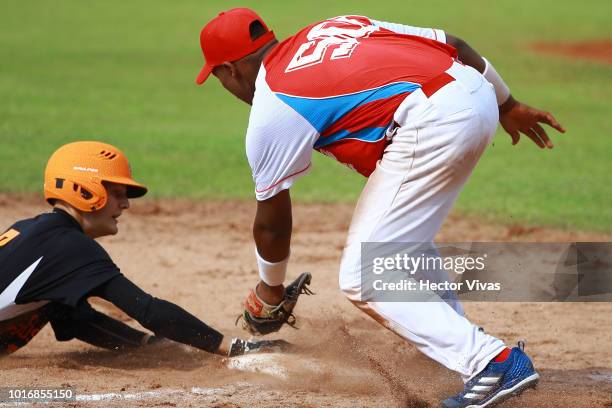 Sebastiaan Van Der Horst of Netherlands safe in third base against Frank Gonzalez of Cuba during the WBSC U-15 World Cup Group B match between...