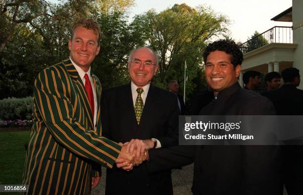 John Howard Prime Minister of Australia with his Captain Shane Lee and Sachin Tendulkar, Captain of India at the Prime Ministers Lodge in Canberra in...