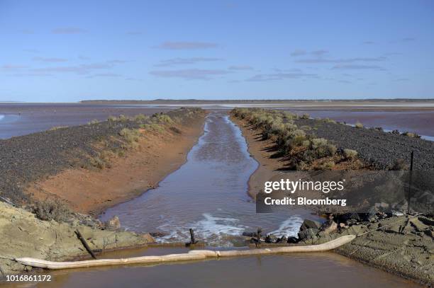 An outlet pipe expels water from the processing plant, not pictured, into Lake Carey at the Granny Smith gold mine , operated by Gold Fields Ltd.,...