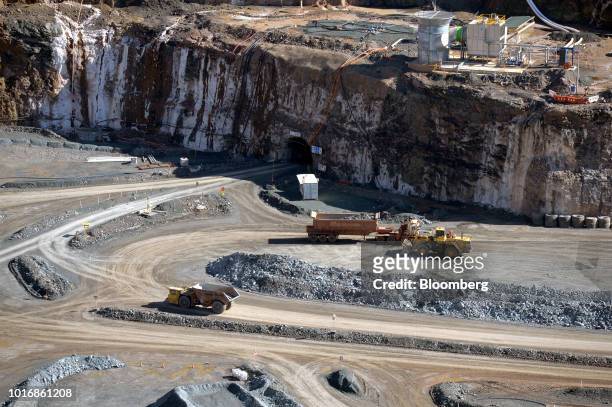 Heavy equipment operates outside a decline portal at an open pit mine at the Granny Smith gold mine , operated by Gold Fields Ltd., outside of...