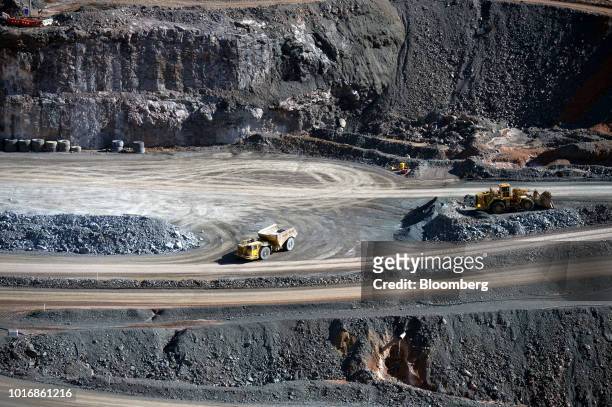 Heavy equipment operates at an open pit mine at the Granny Smith gold mine , operated by Gold Fields Ltd., outside of Laverton, Western Australia,...