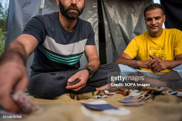 Refugees seen playing cards to kill time in the refugee camp. Refugees trying to make their way into the EU via Bosnia live here in Velika Kladusa in...