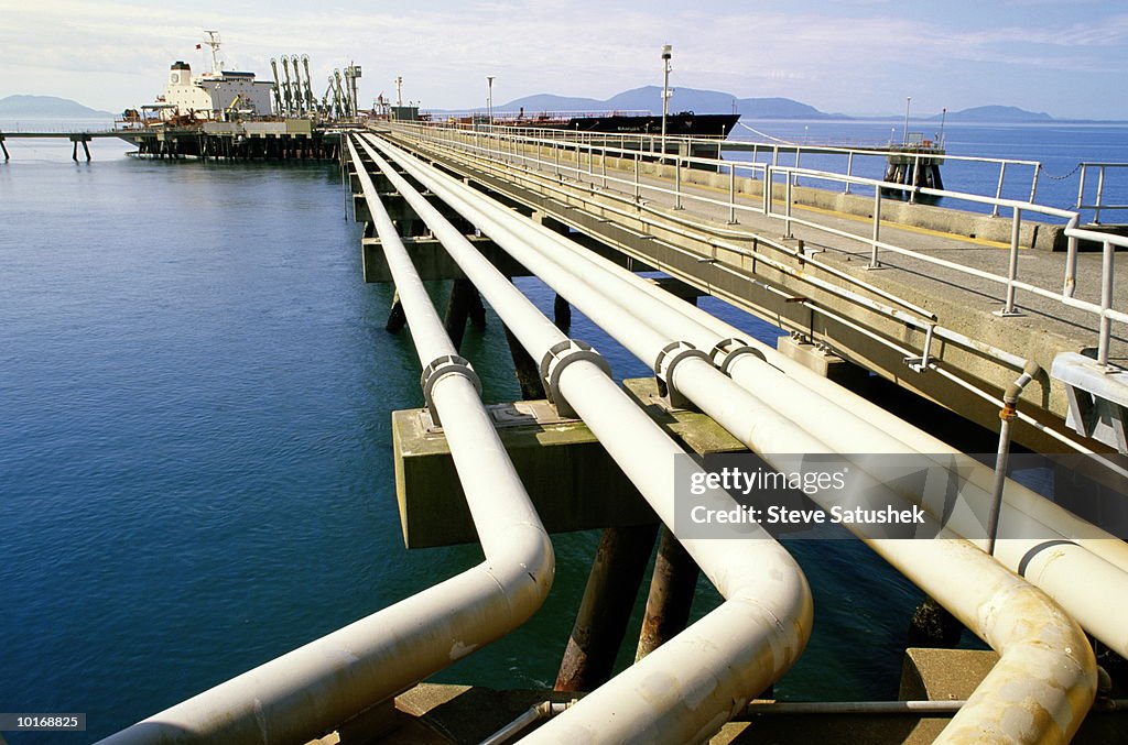 PIPES LEADING TO OIL TANKER AT PIER