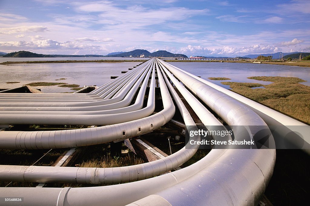 PETROLEUM PIPES AND OIL TANKER AT PIER