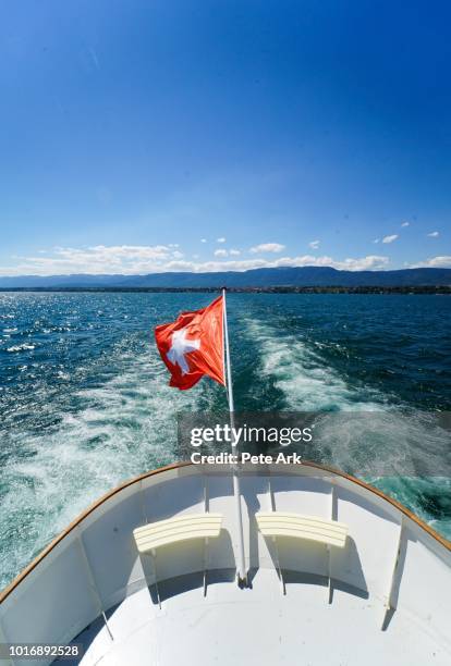 cruising on lake geneva - schweizer flagge stock-fotos und bilder