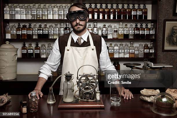 portrait of antiquated chemist with goggles - intellectual property stock-fotos und bilder