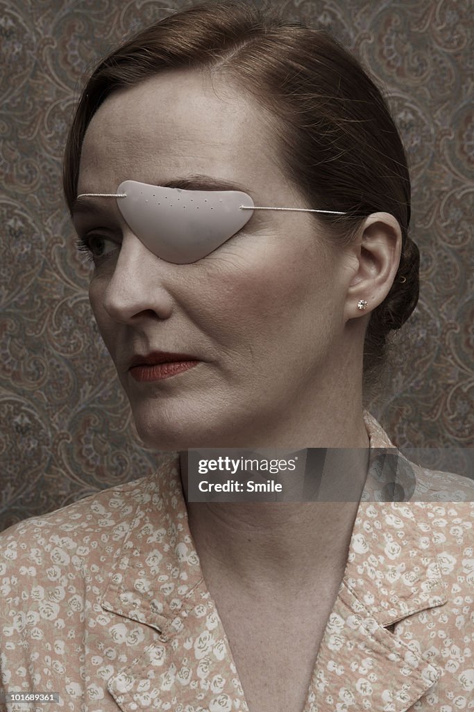 Woman with patch over her eye