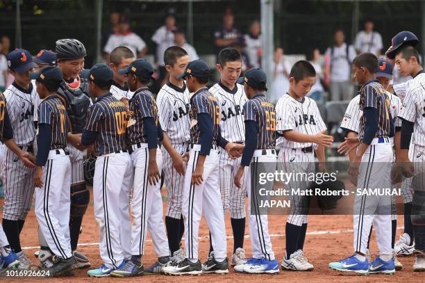 Players of Japan and players of Sri Lanka shake hands after the BFA U-12 Asian Championship Group A match between Sri Lanka and Japan at Xinsheng...