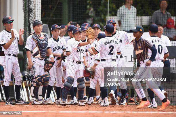 Players of Japan celebrate during the BFA U-12 Asian Championship Group A match between Sri Lanka and Japan at Xinsheng Park Baseball Field on August...