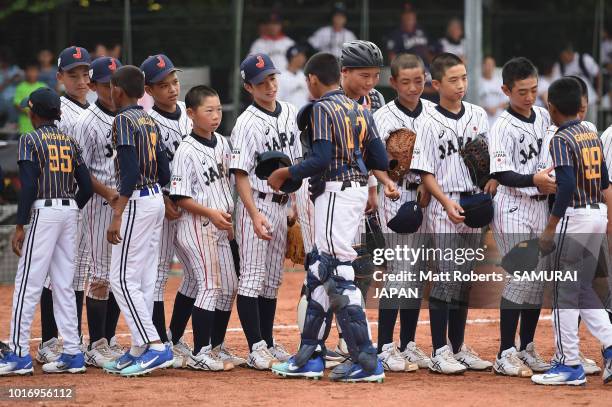 Players of Japan and players of Sri Lanka shake hands after the BFA U-12 Asian Championship Group A match between Sri Lanka and Japan at Xinsheng...