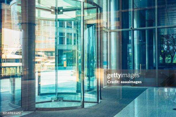 building entrance,revolving door,shanghai - revolving door stock pictures, royalty-free photos & images