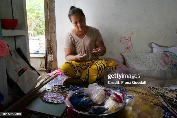 Miliama Lapana makes a traditional woven fan on August 15, 2018 in Funafuti, Tuvalu. She sends the fans to family in New Zealand and sells them to...