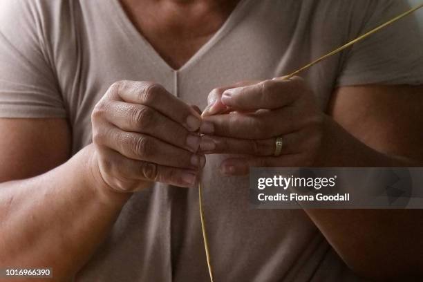 Miliama Lapana makes a traditional woven fan on August 15, 2018 in Funafuti, Tuvalu. She sends the fans to family in New Zealand and sells them to...