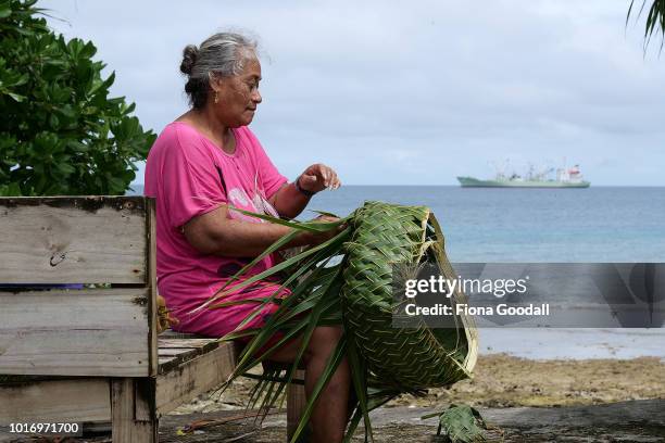 Tepola Raobu weaves a Tapola or basket on August 15, 2018 in Funafuti, Tuvalu. The basket is made with leaves from the Launiu tree and is used for...