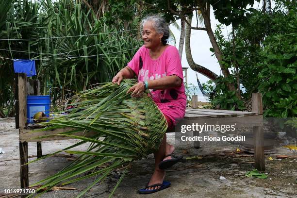 Tepola Raobu weaves a Tapola or basket on August 15, 2018 in Funafuti, Tuvalu. The basket is made with leaves from the Launiu tree and is used for...