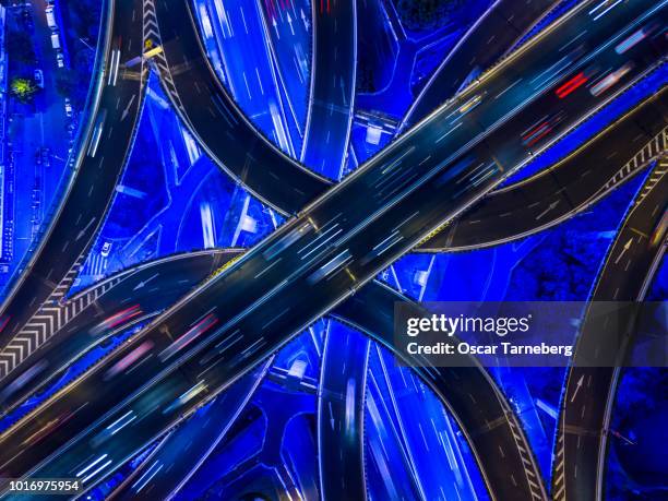 aerial view of neon highway intersection shanghai - shanghai aerial view motorway skyline stock-fotos und bilder