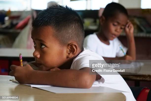 Faiva Nete works on his handwriting at school on August 15, 2018 in Funafuti, Tuvalu. Nauti Primary school is one of two on the main island where...