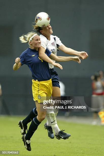 Sweden's Malin Andersson fights for the ball with the USA's Abby Wambach during their soccer match at the 2003 Women's World Cup 21 September at RFK...