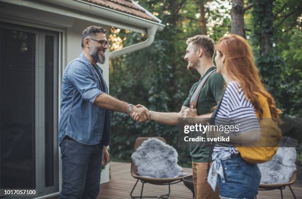 young couple on vacation - party host stock pictures, royalty-free photos & images