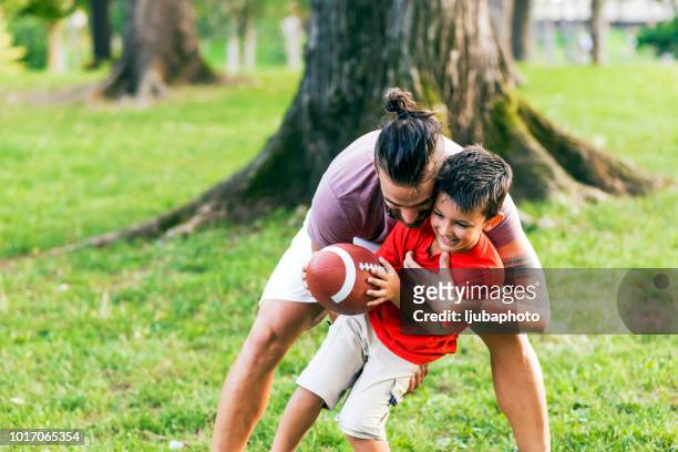 touchdown! - american football family stock pictures, royalty-free photos & images